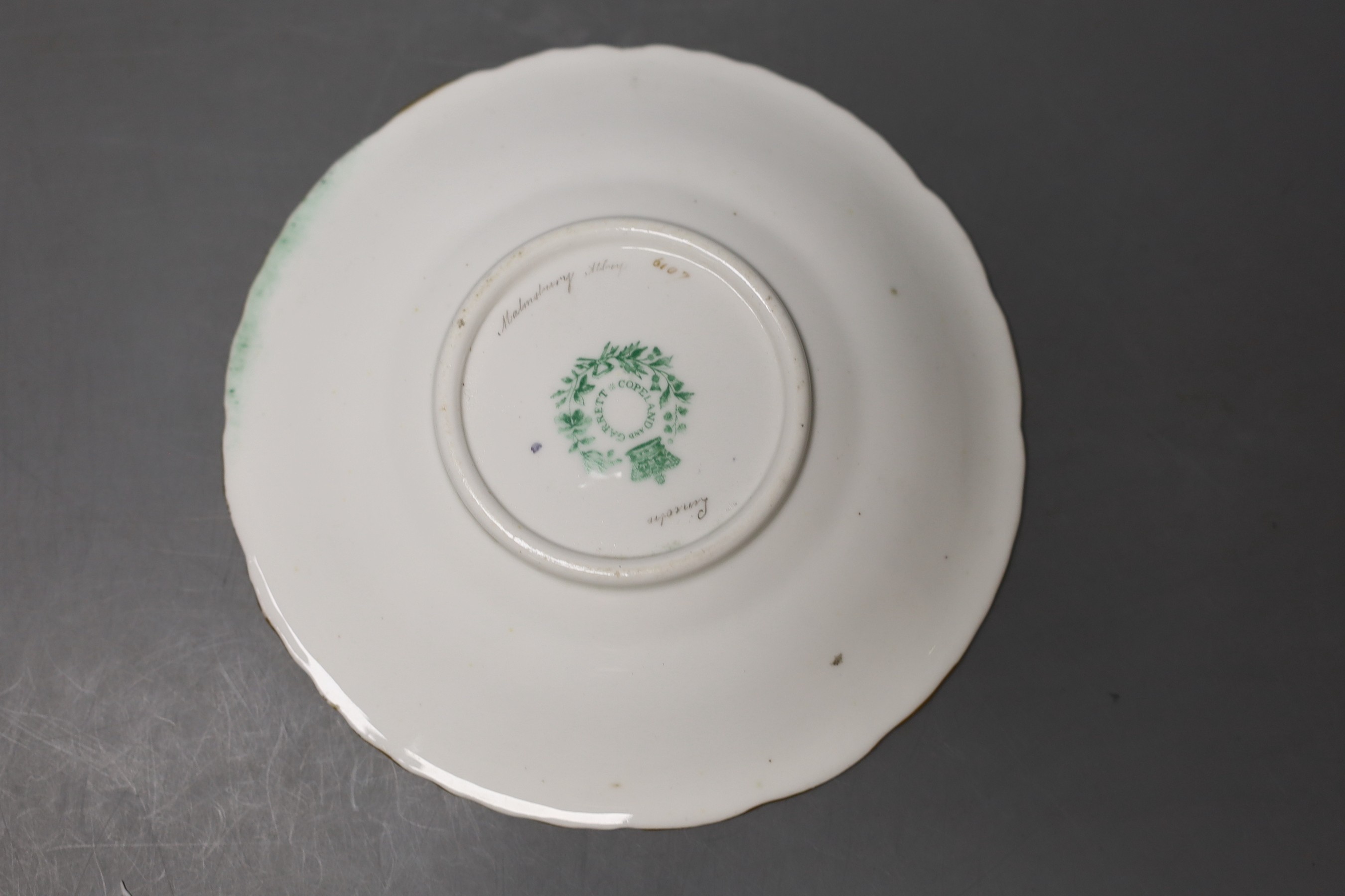 Copeland and Garrett fine topographical pedestal coffee cup and saucer with green ground painted with Sion House on the cup and Lincoln and Malsbury Abbey on the saucer c. 1840